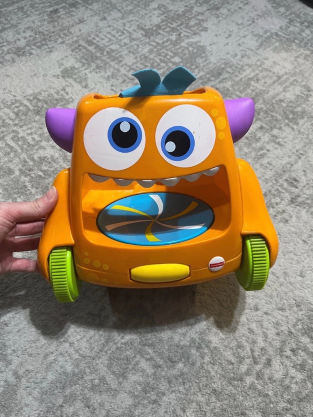Fisher price zoom and crawl monster toy.